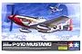 Tamiya 1/32 scale P-51D Mustang plastic model kit box art showing a silver fighter plane with red nose art flying above clouds.