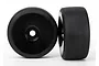 Two black RC car wheels with slick tyres and dish rims, shown from front and side angles against a white background.