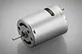 A silver-coloured brushed electric motor for RC vehicles, shown from a three-quarter angle against a grey background.