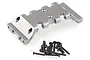A gunmetal grey aluminium RC chassis part shown with a set of black metal screws on a white background.