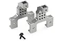 Two gunmetal aluminium RC shock tower mounts with mounting screws on a white background.
