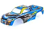 A pre-painted blue RC truck body shell for the HSP Crusher, featuring yellow and silver flame-like graphics and carbon fiber patterns.
