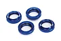 Four blue anodized aluminium shock adjusting nuts with internal black O-rings, arranged on a white background.