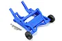 A blue Traxxas wheelie bar assembly with two black wheels and three metal screws on a white background.