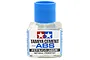 A 40ml bottle of Tamiya Cement for ABS plastic with a blue cap against a white background.