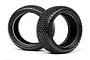 Two black rubber RC buggy tyres with a blocky tread pattern, standing upright against a white background.