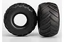 Two black Traxxas Terra Groove RC monster truck tyres shown from side and tread angles against a white background.