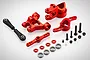 Rovan red aluminium steering and servo saver upgrade kit for RC vehicles, including metal arms, ball links, bearings, and hardware.