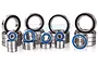 A collection of various sized metal ball bearings with black and blue rubber seals arranged on a white background.