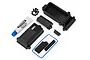 Traxxas TRX-4 sealed receiver box set including black plastic housing parts, screws, a blue rubber gasket, foam pads, and a tube of silicone grease.