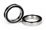 Two metal ball bearings with black rubber seals, one standing upright and one lying flat on a white background.