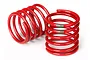 Two red Traxxas shock springs with a green stripe, designed for RC vehicles, shown against a white background.