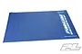 A rectangular blue Pro-Line RC pit mat with a textured surface and white and light blue Pro-Line branding printed on the right side.