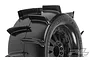 Close-up of a Pro-Line Sand Paw paddle tyre mounted on a black F-11 wheel against a white background.