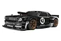 HPI Racing 1/10 scale RC Hoonicorn 1965 Ford Mustang drift car in black with bronze wheels and sponsor decals.