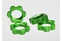 Four bright green anodized aluminium splined wheel nuts for Traxxas RC vehicles arranged on a white background.