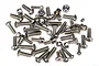 A collection of various stainless steel screws, bolts, and nuts for the Traxxas DCB M41 RC boat, scattered on a white background.