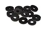 A pile of black circular foam body shell washers for RC cars on a white background.