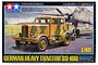 Tamiya 1/48 scale German SS-100 Heavy Tractor model kit box art showing the truck towing an aircraft on an airfield.