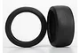Two black slick RC car tyres shown from front and side angles against a white background.