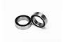 Two Traxxas 10x15x4mm rubber shielded ball bearings shown against a clean white background.