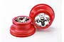 Two Traxxas RC short course wheels with red outer rims and chrome-plated five-spoke centers against a white background.