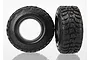 Two black Traxxas Kumho Road Venture RC short course tyres with aggressive tread patterns, shown from front and side angles against a white background.