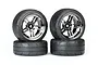 Four Traxxas 1.9 inch Response tires pre-glued to black chrome split-spoke wheels, arranged in two stacks of two against a white background.