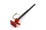 A red and black metal high lift jack accessory for 1/10 scale RC rock crawlers, featuring a textured base and a small attached chain.