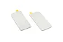 Two rectangular silver side view mirror lenses for an RC car with small yellow adhesive tabs on a white background.