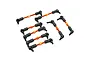 A set of orange anodized aluminium turnbuckle linkages with black plastic ball ends for RC cars.