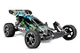 Traxxas Bandit VXL 1/10 scale RC buggy with blue, green, and black graphic body, chrome wheels, and off-road tires against a white background.