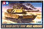 Tamiya 1/48 scale U.S. M1A2 Abrams Main Battle Tank plastic model kit box art showing a desert-camo tank in action.