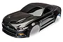 A pre-painted black Traxxas 1/10 scale Ford Mustang RC car body shell viewed from a high angle.