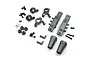A set of grey aluminium upgrade parts for an RC car, including steering knuckles, suspension mounts, and various screws and pins on a white background.