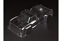 A clear, unpainted polycarbonate RC truck body shell for an ARRMA 1/8 scale Outcast, shown from a high-angle perspective against a black background.