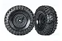 Two Traxxas 1.9 inch Canyon Trail crawler tires pre-mounted on black tactical wheels against a white background.