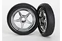 Two Traxxas 1.9 inch drag racing wheels with chrome five-spoke rims and black rubber tyres against a white background.