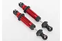 Two assembled red aluminium GTS shock absorbers for Traxxas TRX-4 RC vehicles, shown against a plain white background.