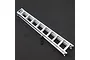 A silver aluminium scale ladder accessory for RC vehicles, featuring a small black chain attached to the side, set against a dark textured background.