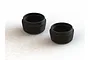 Two black aluminium lower shock caps for ARRMA RC vehicles, shown from an angled top-down perspective on a white background.