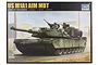 Product box art for a Trumpeter 1/16 scale US M1A1 AIM MBT plastic model kit featuring an illustration of the tank in a desert environment.