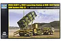 Box art for a Trumpeter 1/35 scale model kit of the M983 HEMTT and M901 Patriot missile launching station, featuring a desert landscape illustration.
