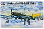 Box art for a 1/32 scale Trumpeter Junkers Ju-87B-2/U4 Stuka model kit showing the aircraft on skis in a snowy landscape with pilots.