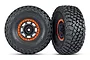 Two Traxxas 2.2/3.2 inch BFGoodrich Baja KR3 RC tires mounted on black rims with orange beadlock-style rings, shown against a white background.