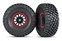 Two Traxxas 2.2/3.2 inch BFGoodrich Baja KR3 tires mounted on black and red Method Racing wheels, shown from front and side angles.