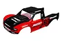 A pre-painted Traxxas Unlimited Desert Racer body shell in red and black with Rigid Industries and BFGoodrich branding.