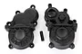 Two black plastic Traxxas E-Revo VXL 2.0 centre gearbox halves and a small metal pin on a white background.