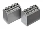 Two grey plastic block-like components with four studs on top, resembling building bricks.