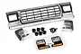 Traxxas TRX-4 Ford Bronco chrome front grille assembly with headlight mounts, clear lenses, screws, and decal sheet.